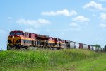 A norzhbound grain train passes through the tiny town of Hillje